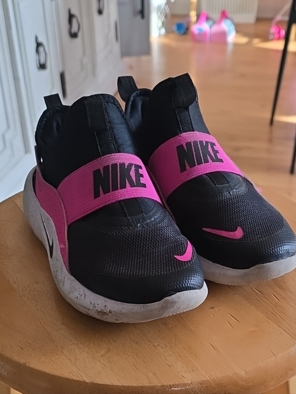 Nike Kids Slip-On Sneakers in Black with Pink Strap